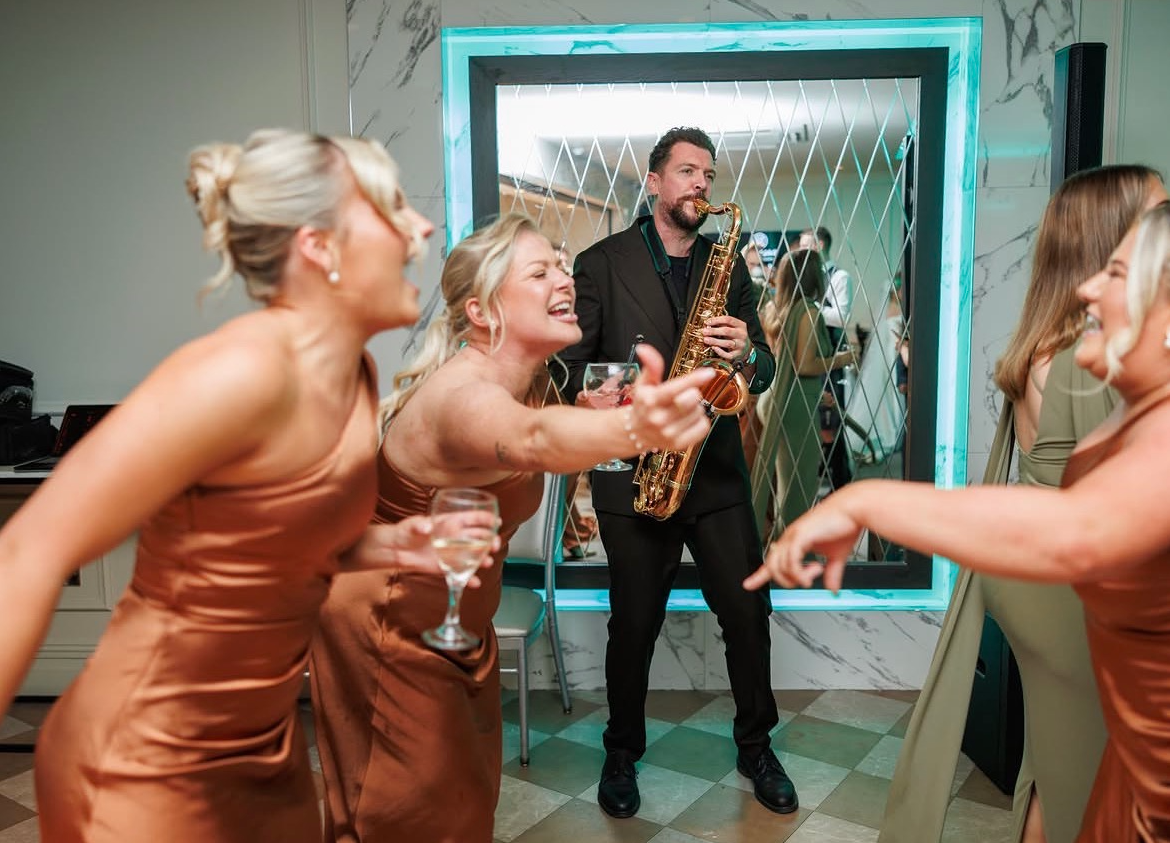 Josh with saxophone at events, click to read client reviews